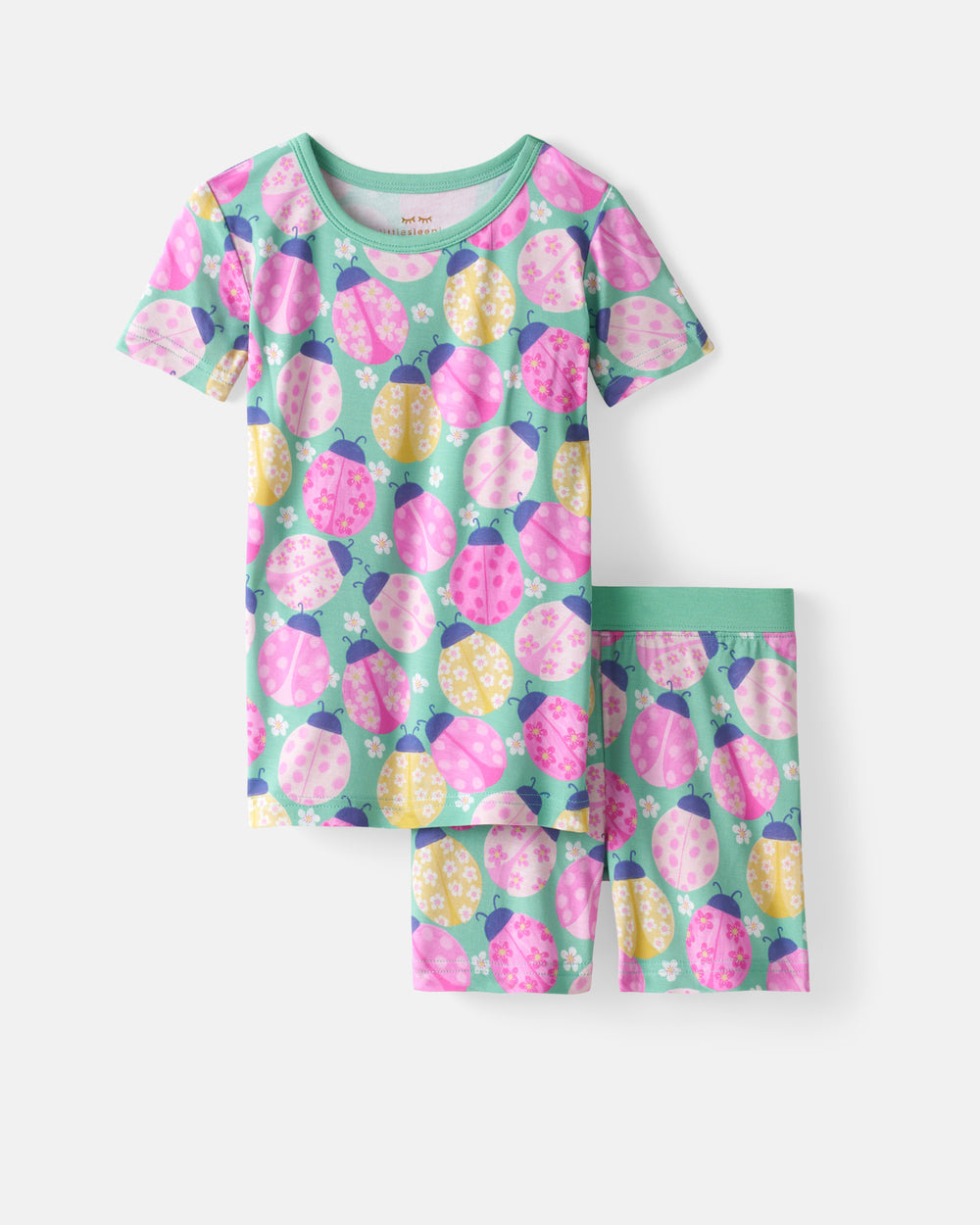 Flat lay of the Ladybug Meadow Two-Piece Short Sleeve & Shorts Pajama Set