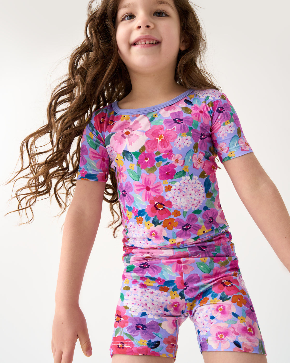 Close up of child wearing the Sweet Sprigs Floral Two-Piece Short Sleeve & Shorts Pajama Set
