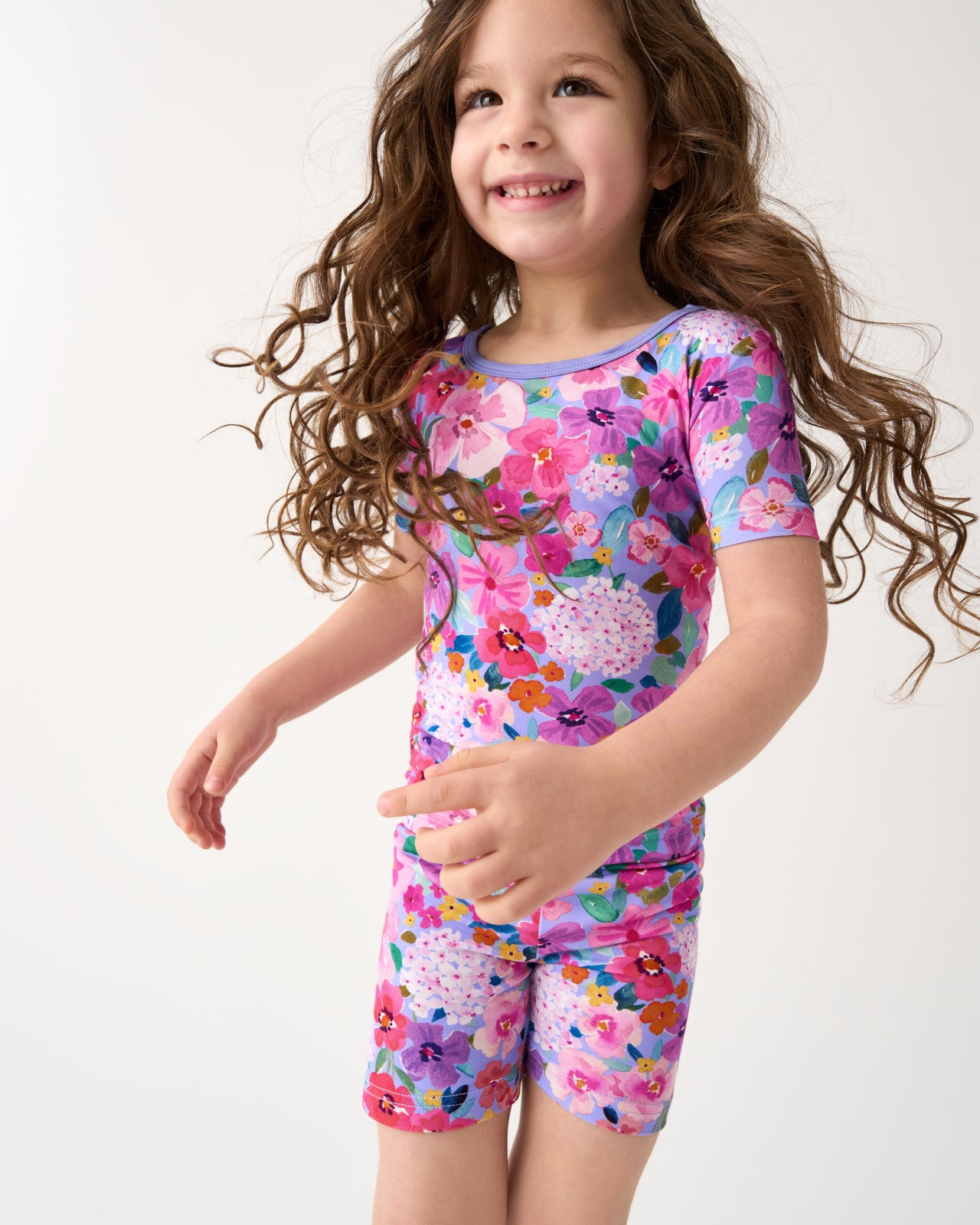 Close up of girl wearing the Sweet Sprigs Two-Piece Short Sleeve & Shorts Pajama Set