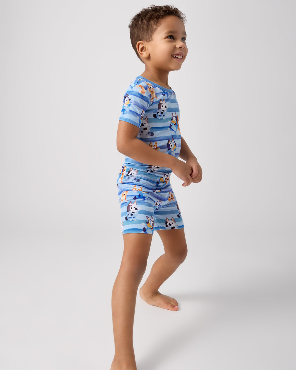 Standing child wearing the Bluey Dance All Day Two-Piece Short Sleeve & Shorts Pajama Set