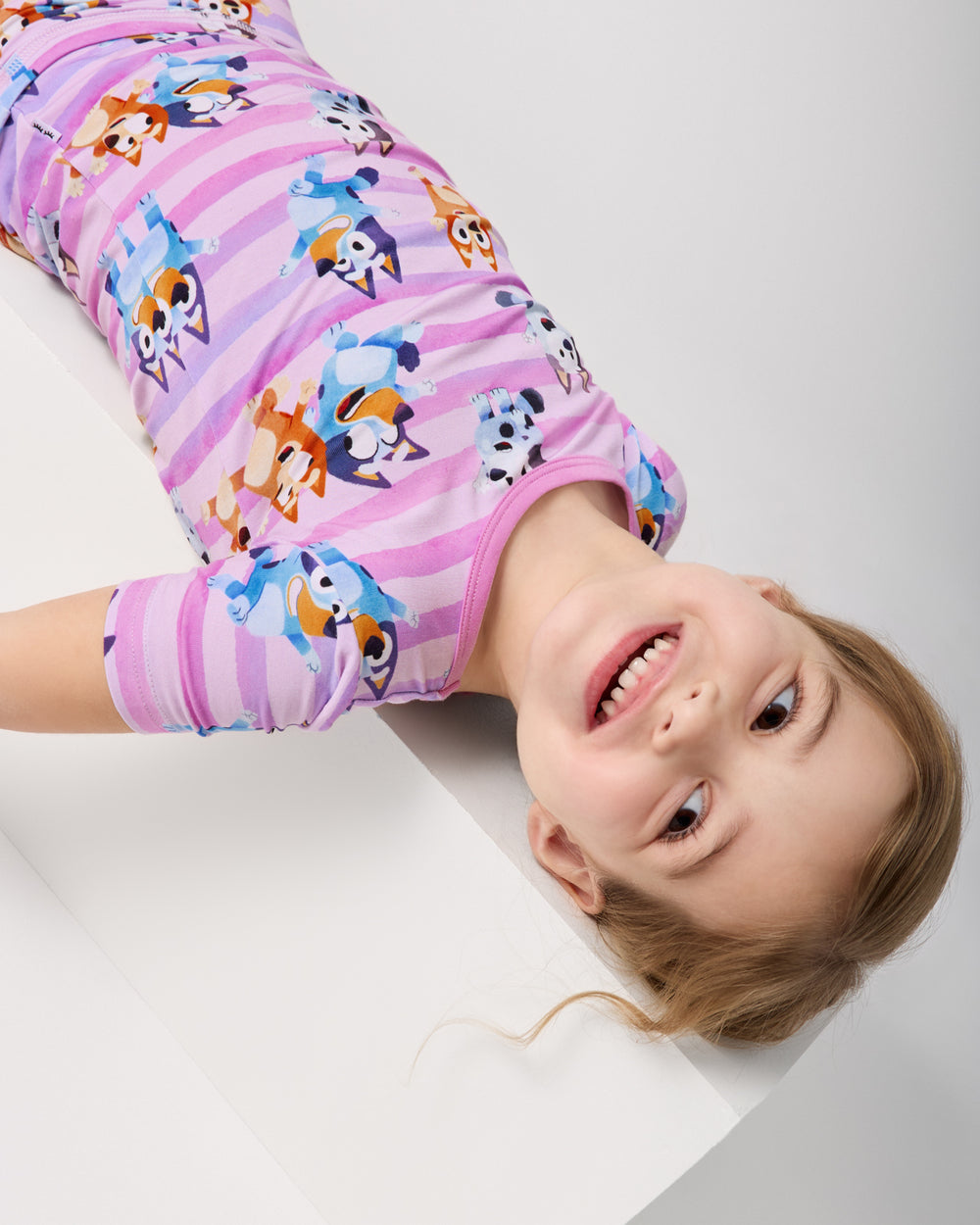 Close up of girl wearing the Pink Bluey Dance All Day Two-Piece Short Sleeve & Shorts Pajama Set