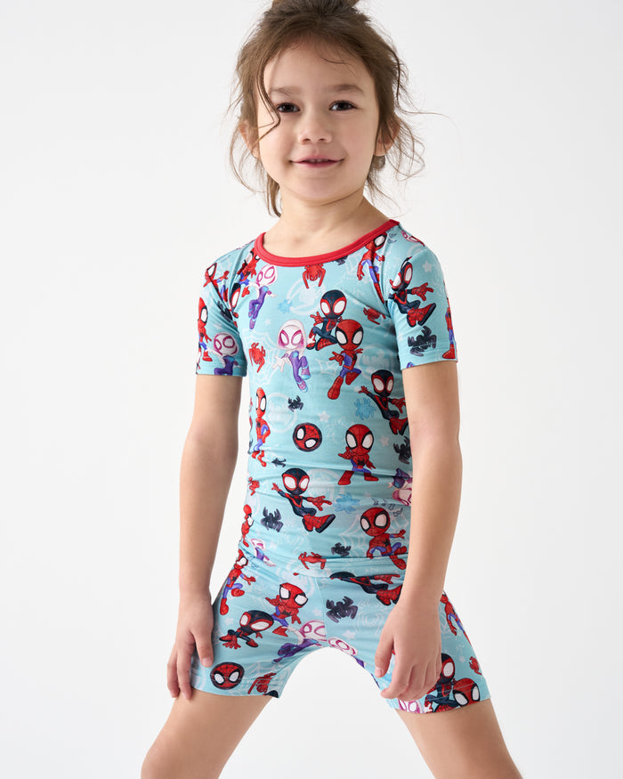 Girl wearing the Spidey & Friends Tiny Webs Two-Piece Short Sleeve & Shorts Pajama Set