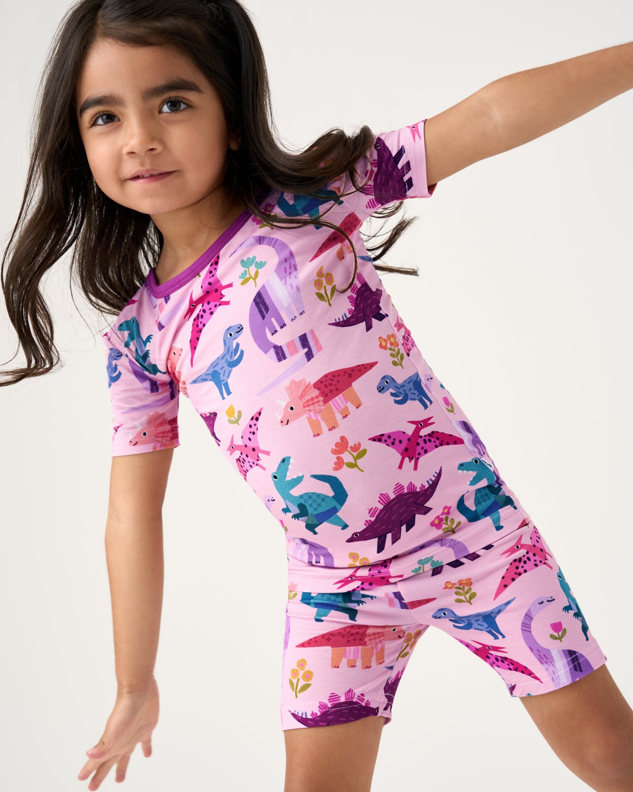 Close up of girl wearing the Pink Roar & Explore Two-Piece Short Sleeve & Shorts Pajama Set