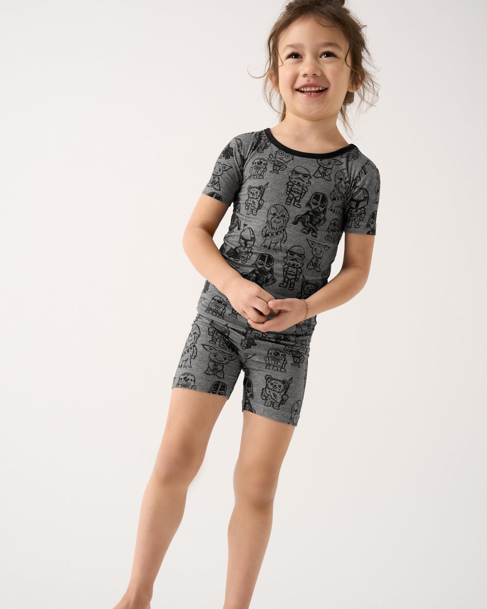 Girl wearing the Star Wars Far, Far, Away Friends Two-Piece Short Sleeve & Shorts Pajama Set