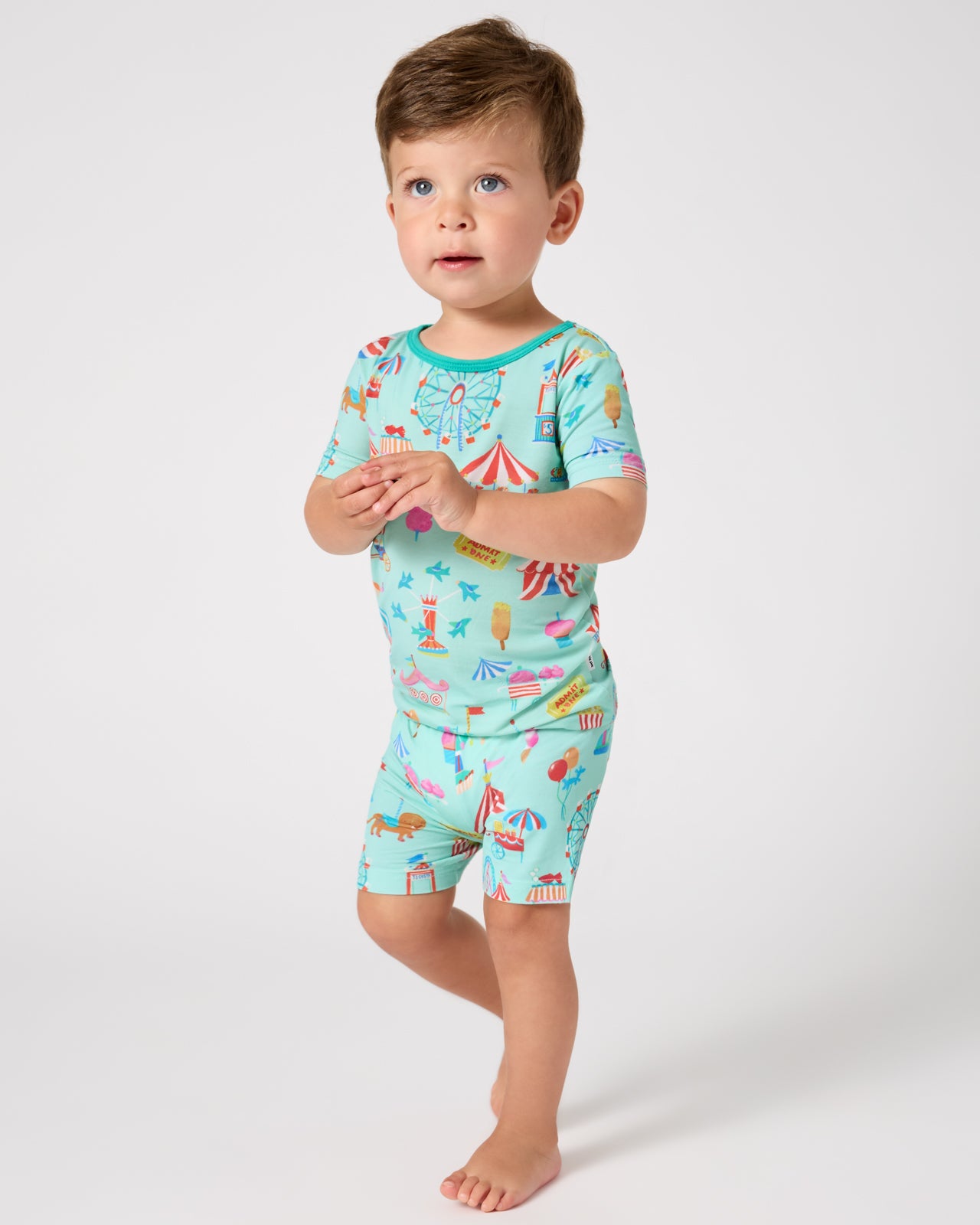 Boy wearing the Fizzy Fair Two-Piece Short Sleeve & Shorts Pajama Set