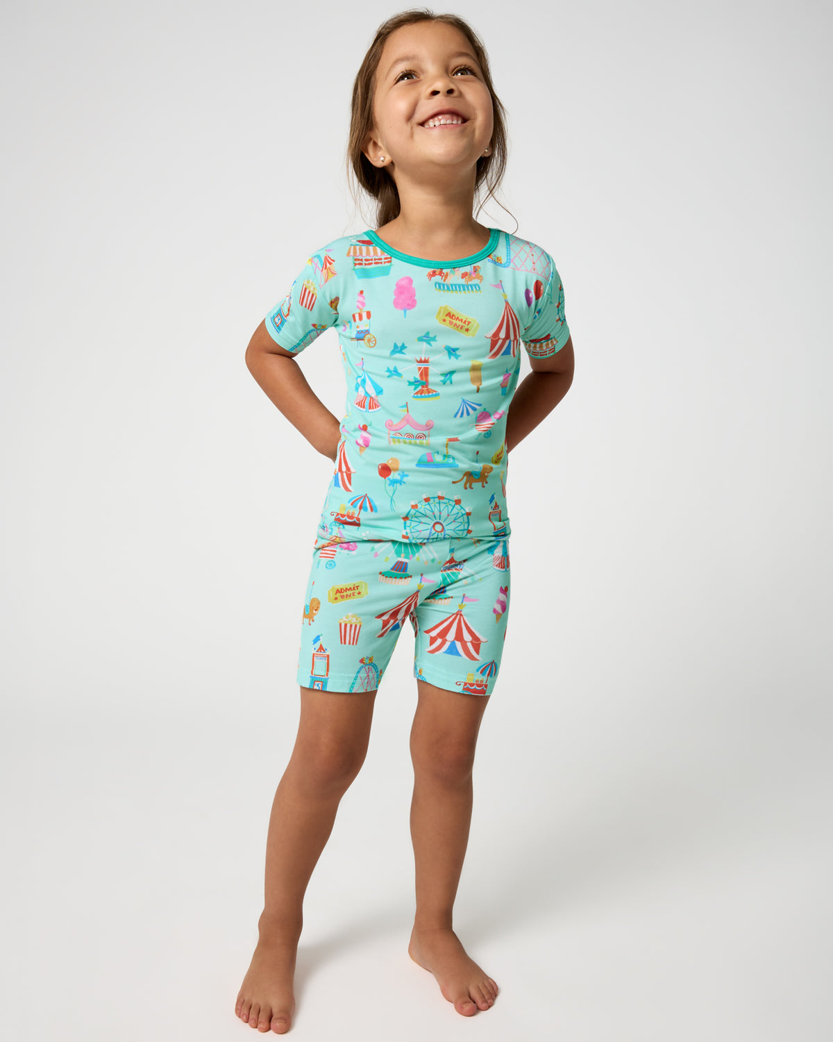 Girl wearing the Fizzy Fair Two-Piece Short Sleeve & Shorts Pajama Set