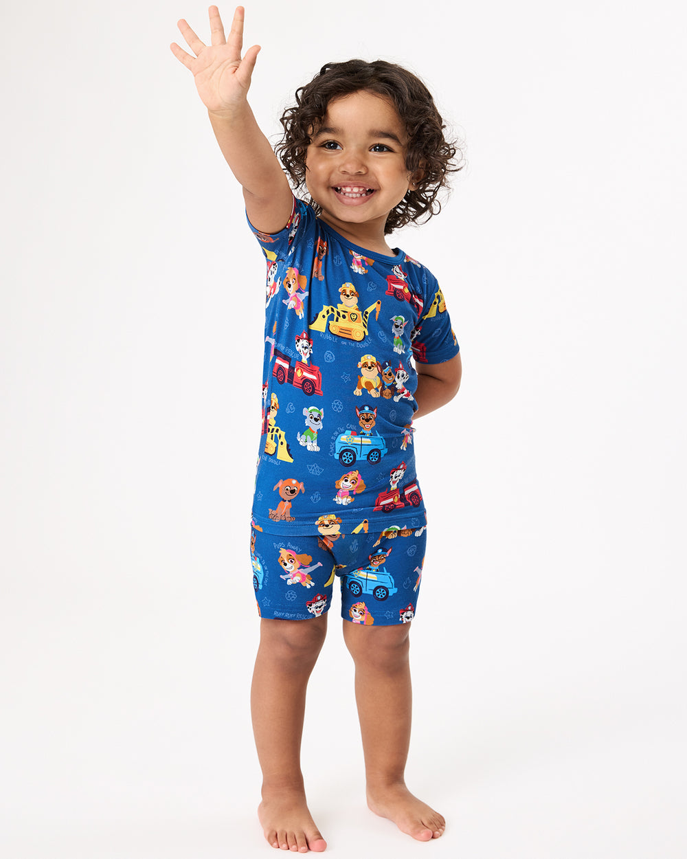 Standing girl wearing the PAW Patrol Adventure Bay Heroes Two-Piece Short Sleeve & Shorts Pajama Set