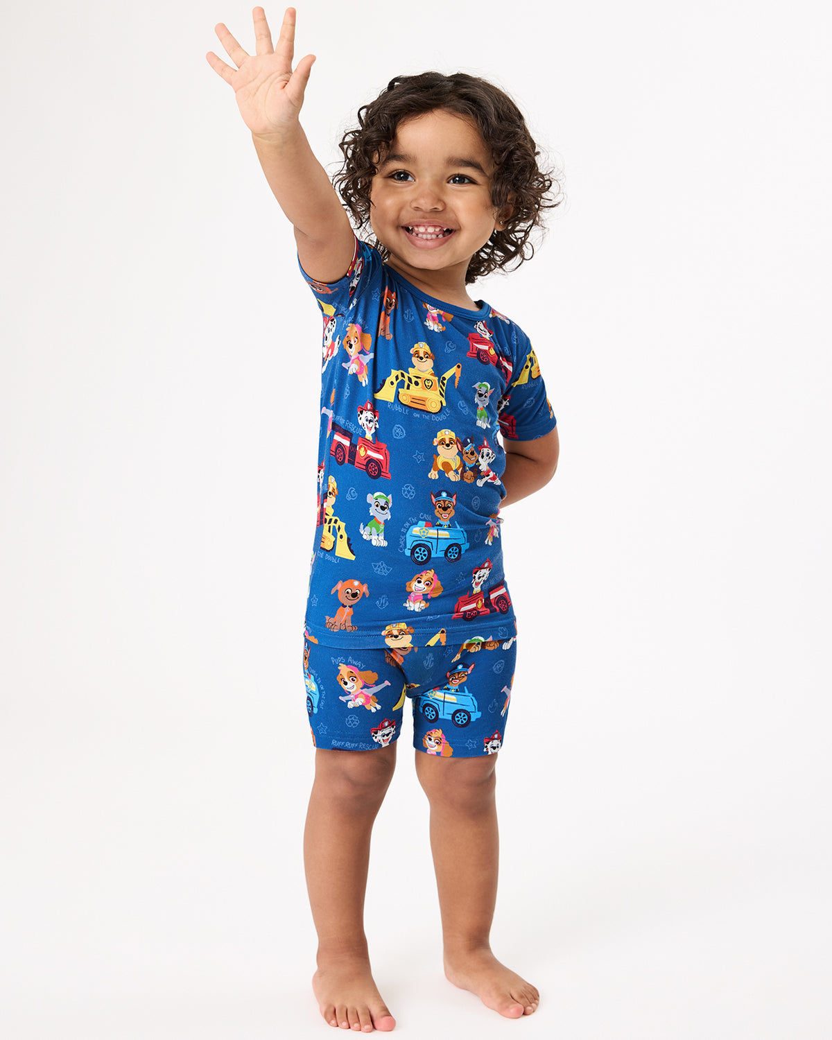 Standing girl wearing the PAW Patrol Adventure Bay Heroes Two-Piece Short Sleeve & Shorts Pajama Set