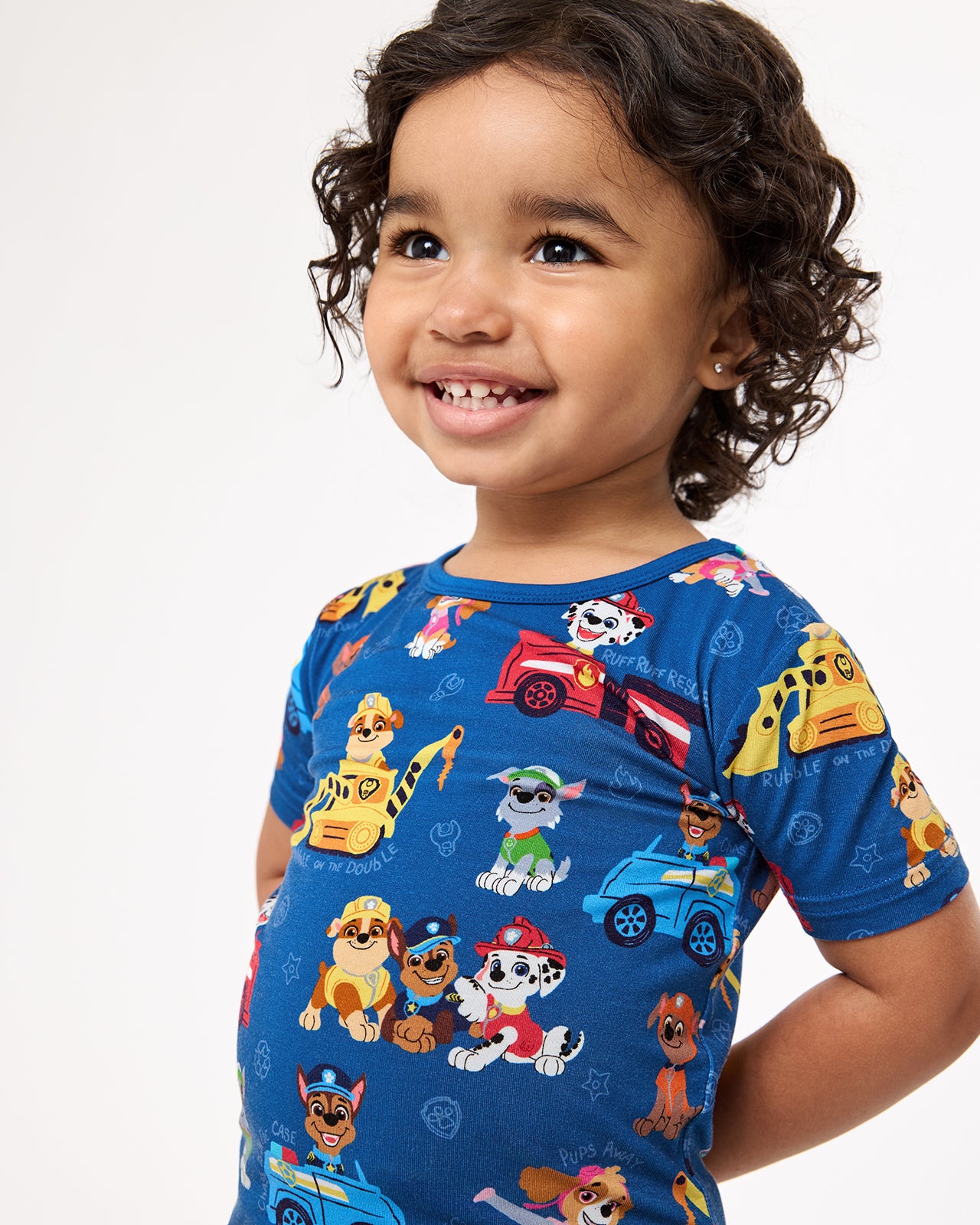 Close up of girl wearing the PAW Patrol Adventure Bay Heroes Two-Piece Short Sleeve & Shorts Pajama Set
