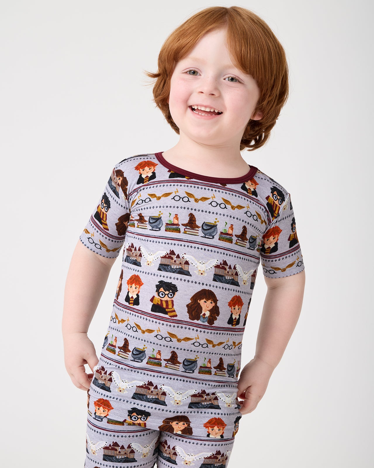 Close up of boy wearing the Harry Potter™ Spellbinding Studies Two-Piece Short Sleeve & Shorts Pajama Set