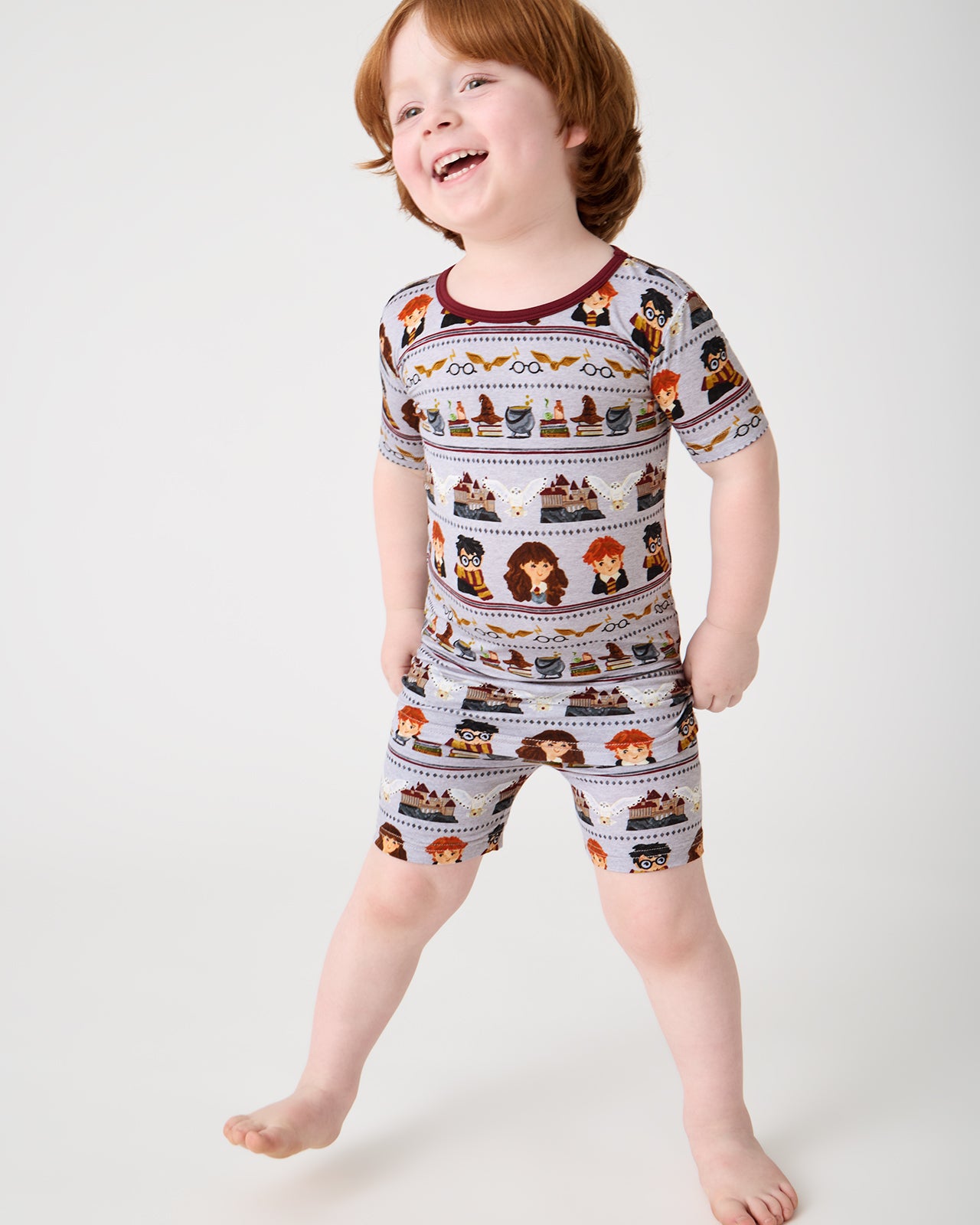 Boy wearing the Harry Potter™ Spellbinding Studies Two-Piece Short Sleeve & Shorts Pajama Set