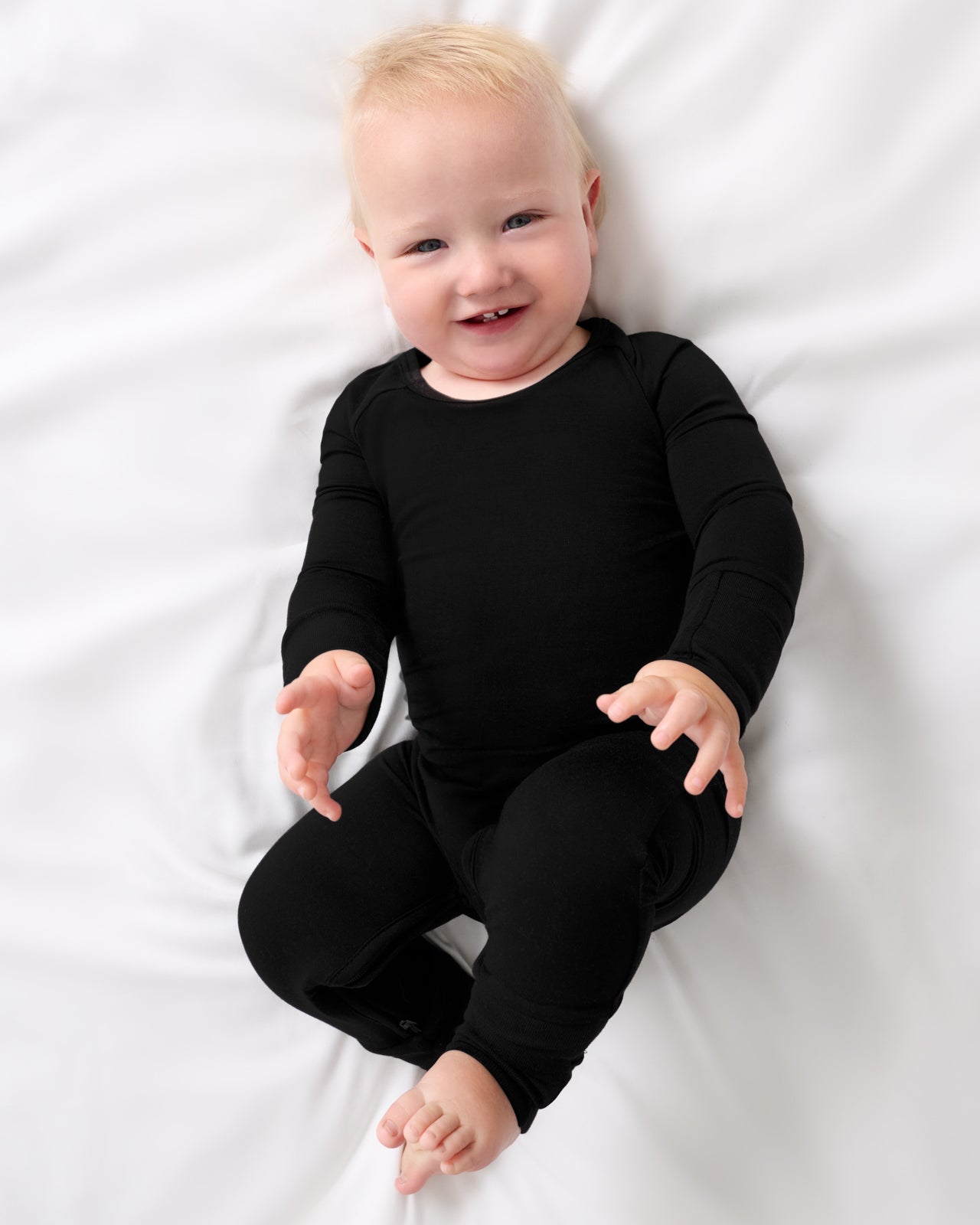 Aerial view of baby wearing the Black Crescent Zippy