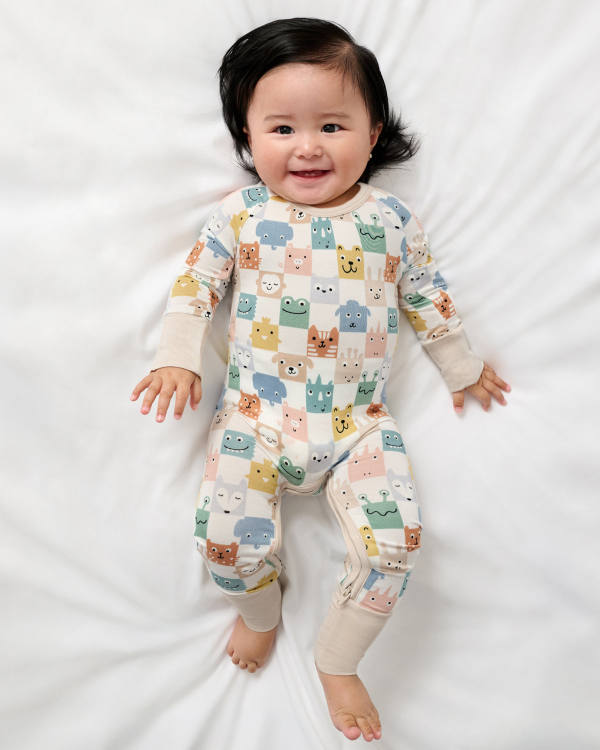 Aerial view of baby wearing the Check Mates Crescent Zippy