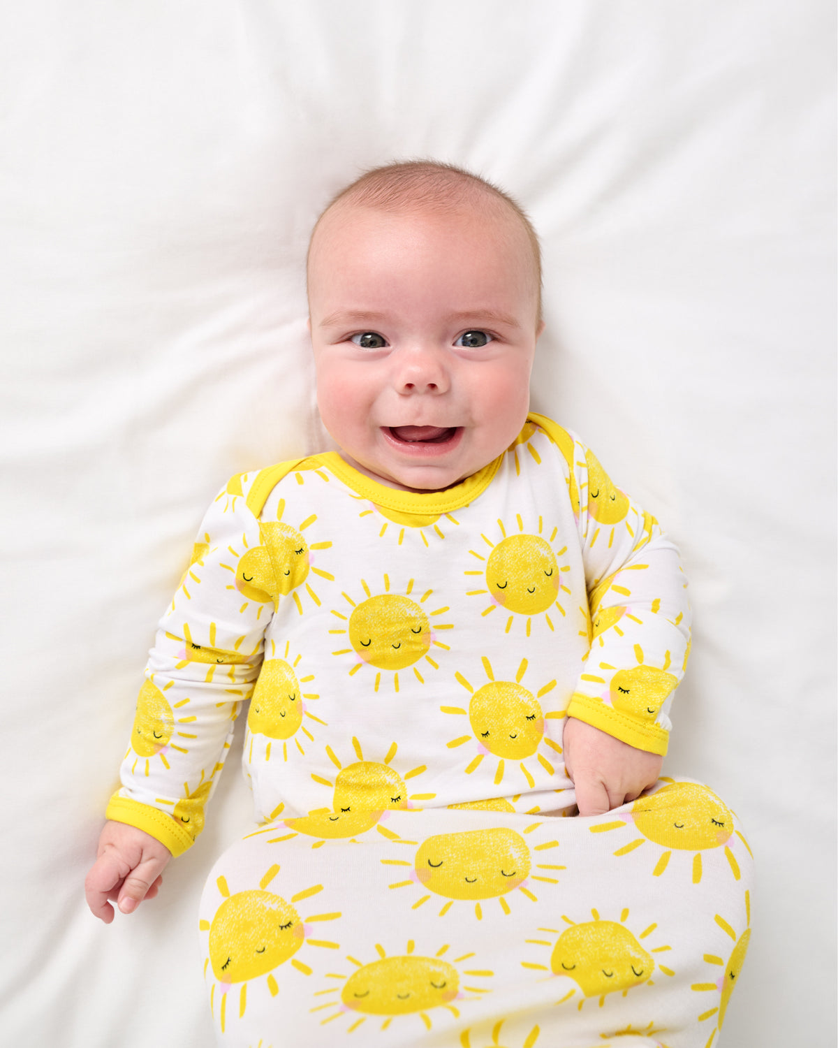 Newborn wearing the Sunshine Infant Gown