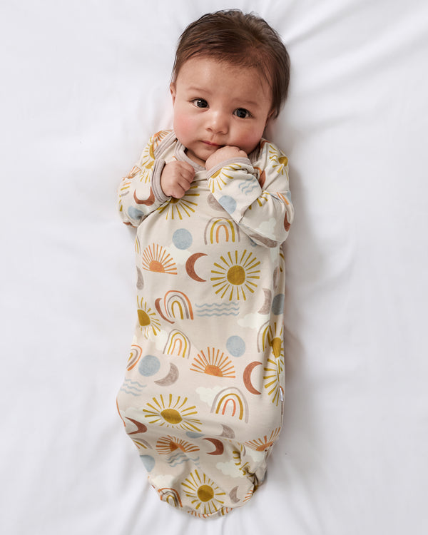 Aerial view of baby wearing the Desert Sunrise Infant Gown
