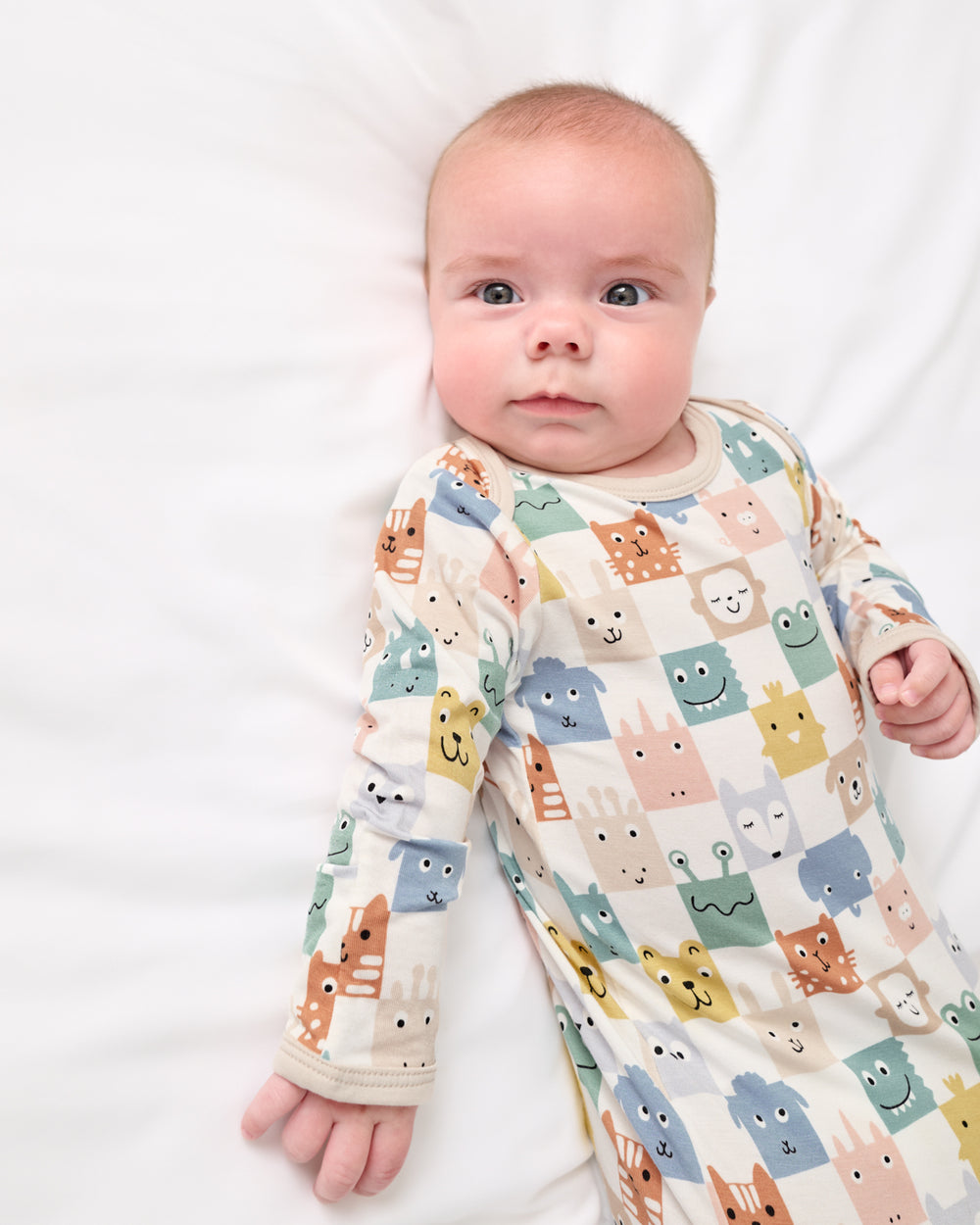 Newborn baby wearing the Check Mates Infant Gown