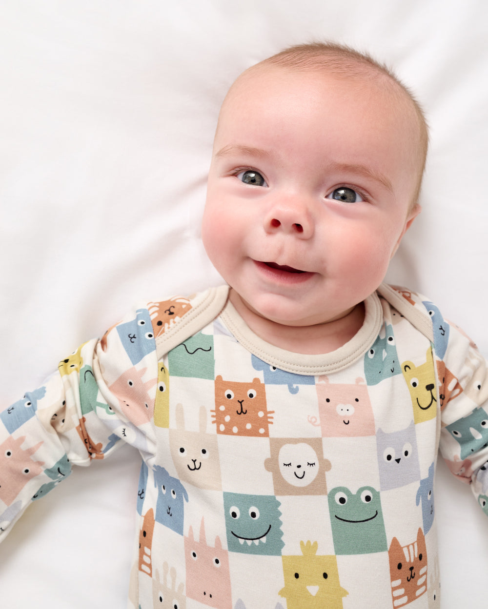 Close up of newborn in the Check Mates Infant Gown