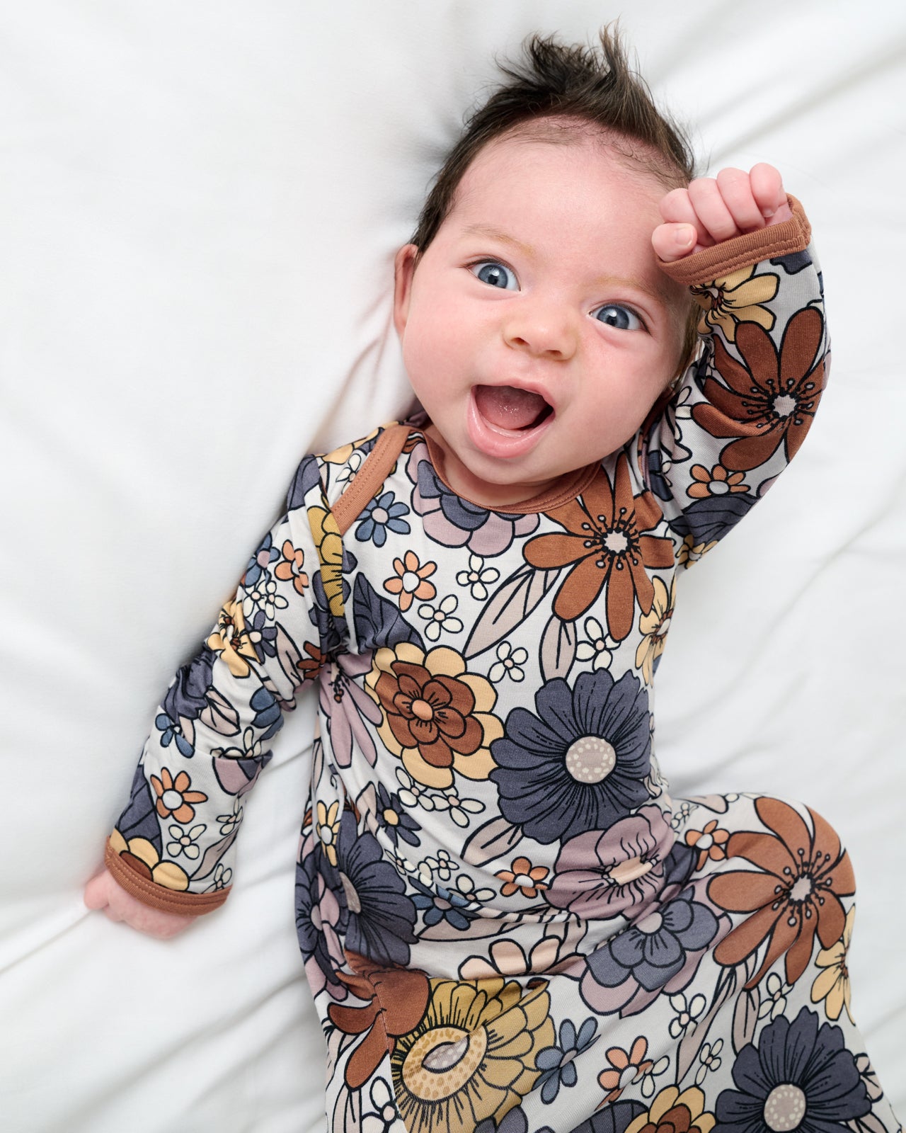 Close up of baby wearing the Wildwood Floral Infant Gown