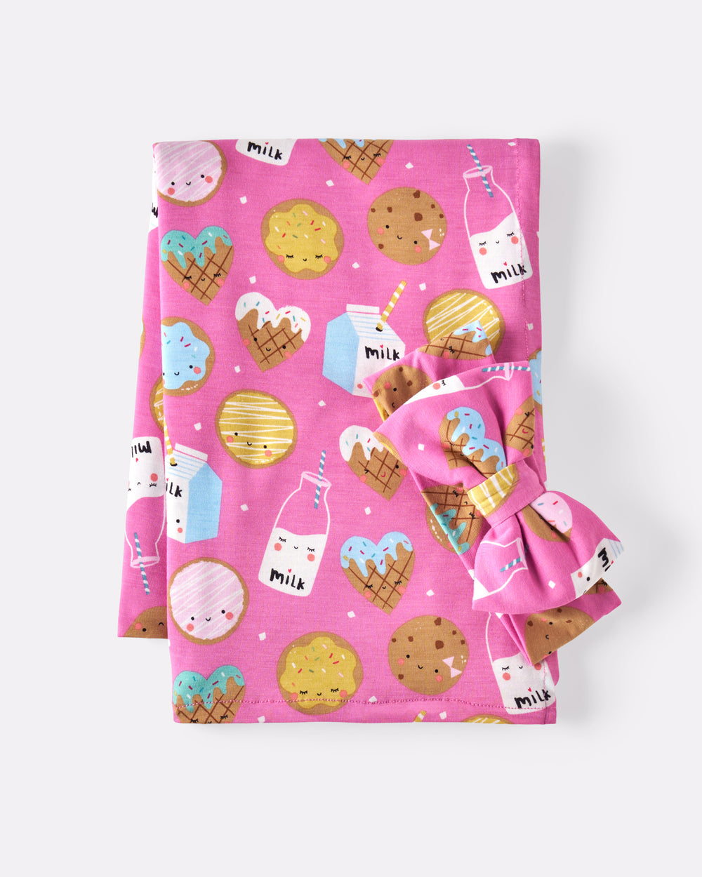 Flat lay of the Pink Cookies & Milk Swaddle & Luxe Bow Headband Set