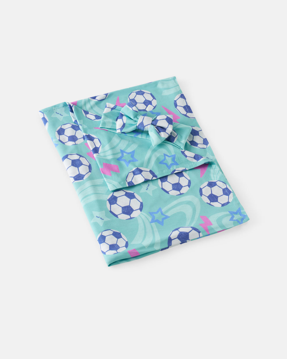 Flat lay of the Aqua Soccer Stars Swaddle & Luxe Bow Headband Set