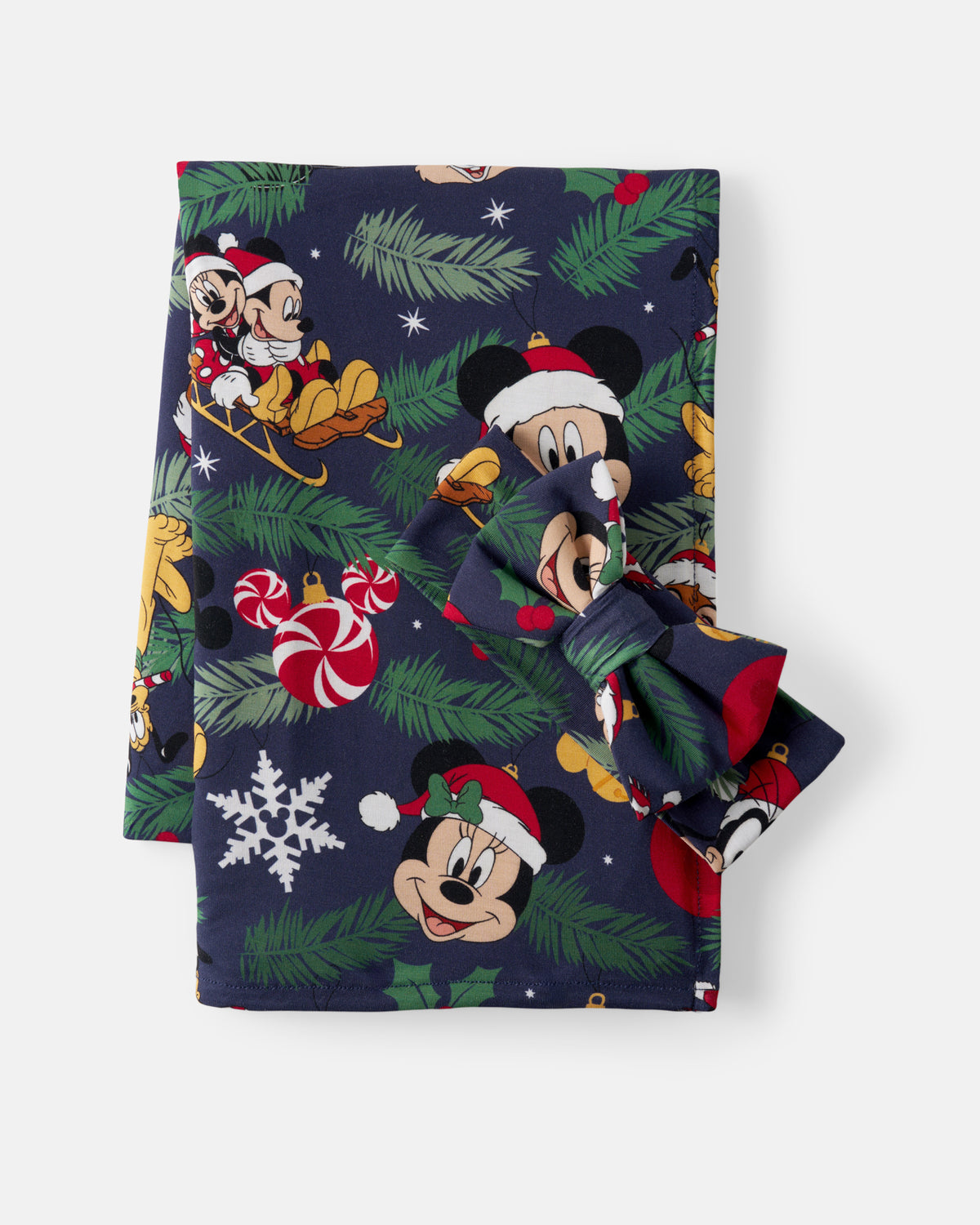 A folded navy blue swaddling blanket featuring a festive Christmas print with Mickey Mouse and Minnie Mouse, pine branches, candy canes, snowflakes, and Santa hats, tied with a matching bow on a light gray background.