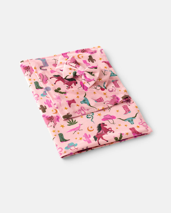 Flat lay of the Pink Rancher Roundup Swaddle & Luxe Bow Headband Set