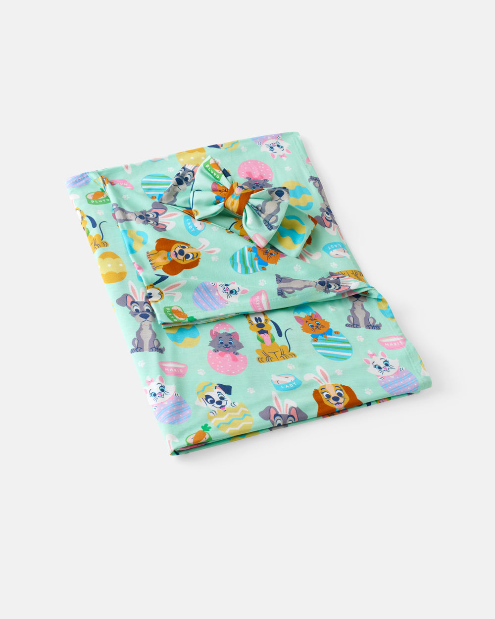 Flat lay of the Disney Peekaboo Pets Swaddle & Luxe Bow Headband Set