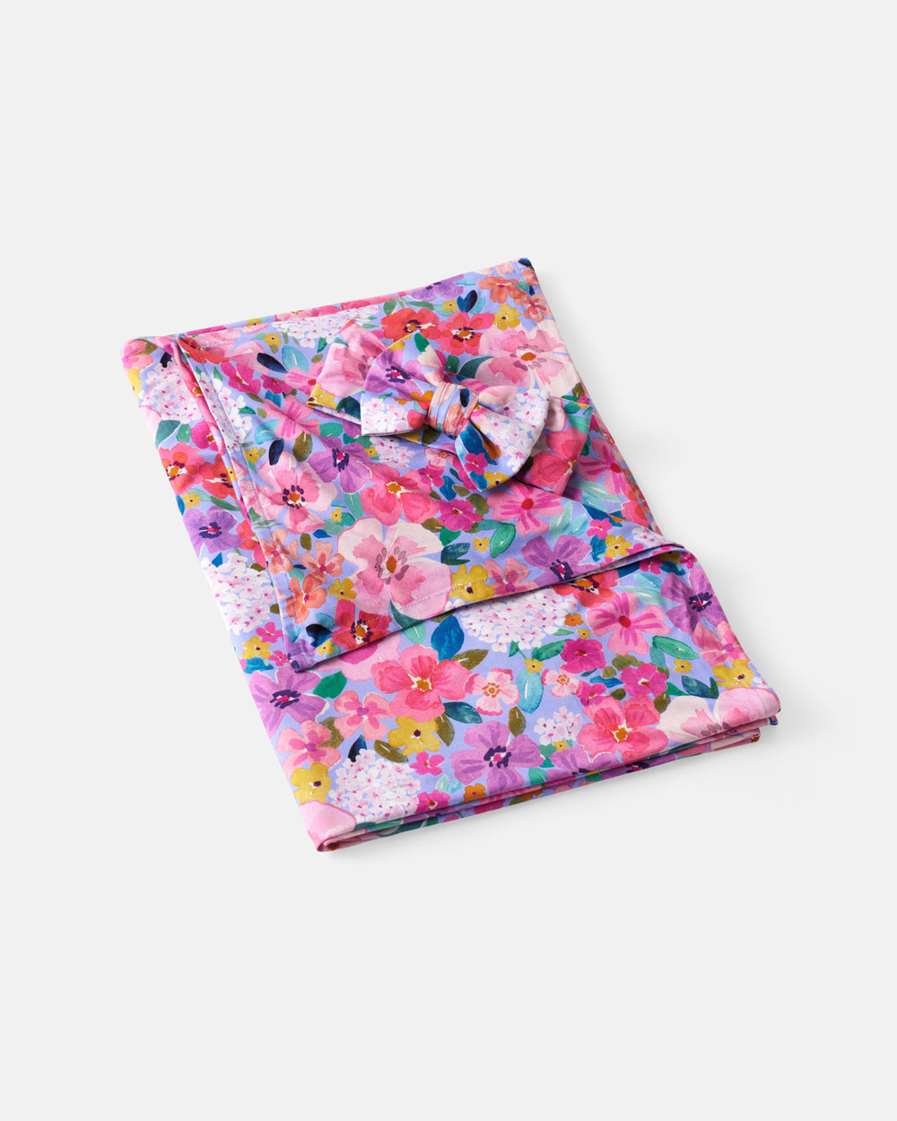 Flat lay of the Sweet Sprigs Swaddle & Luxe Bow Headband Set