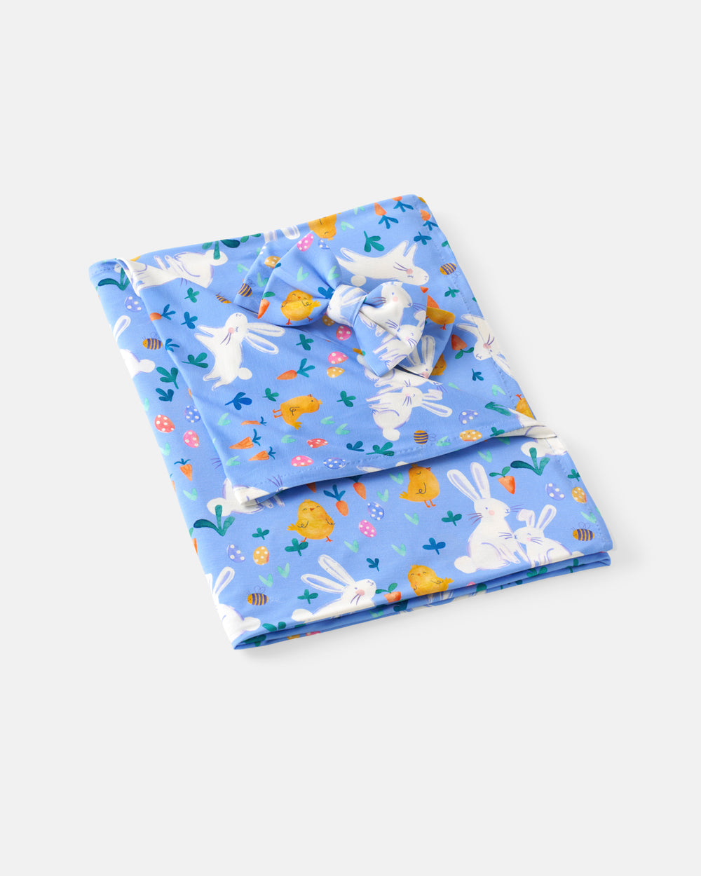 Flat lay of the Bunny Patch Swaddle & Luxe Bow Headband Set