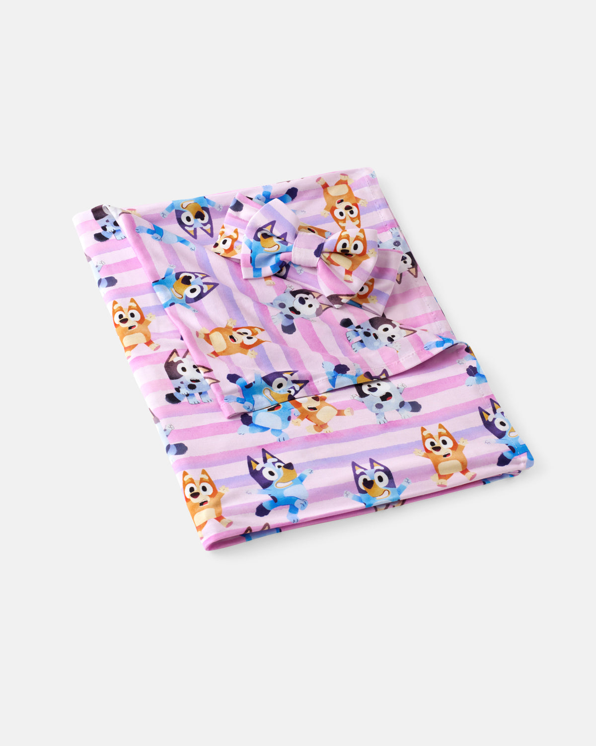 Flat lay of the Pink Bluey Dance All Day Swaddle & Luxe Bow Headband Set