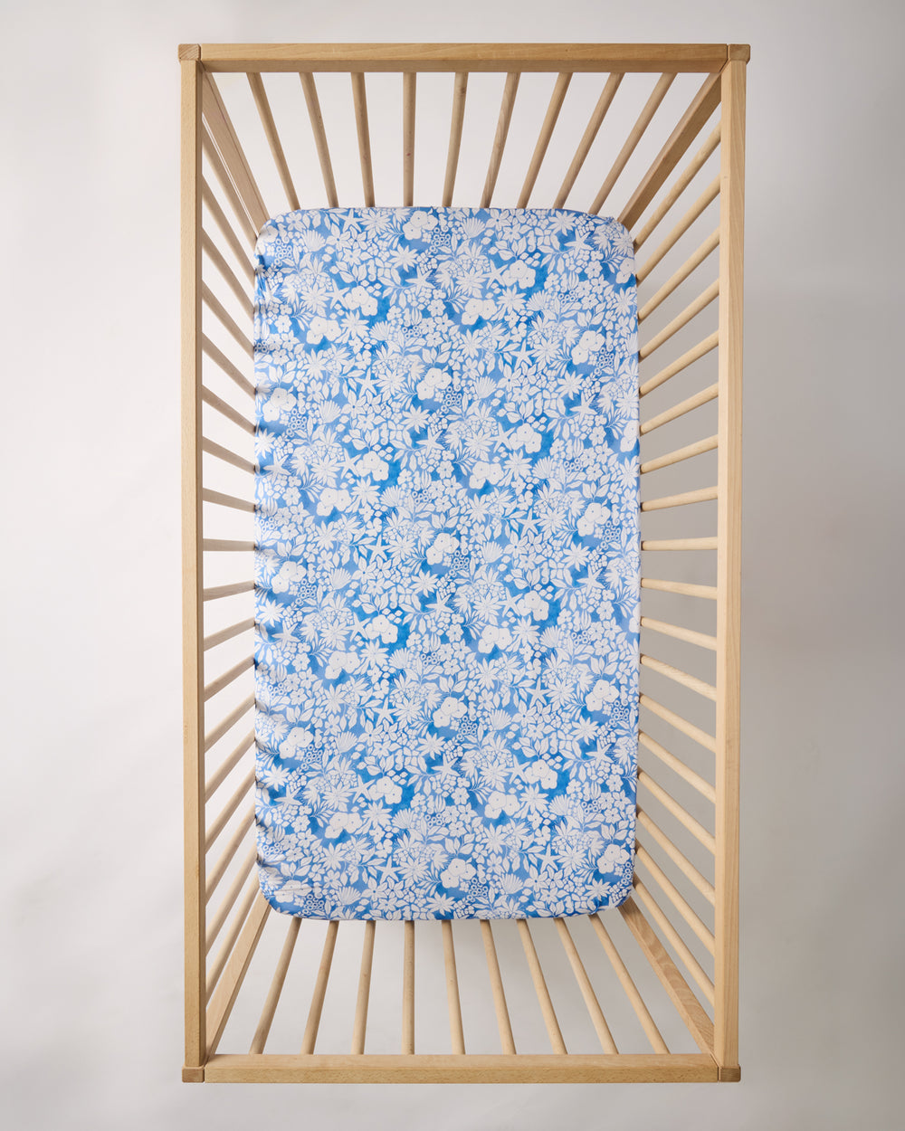 Overhead show of the Azure Garden Fitted Crib Sheet