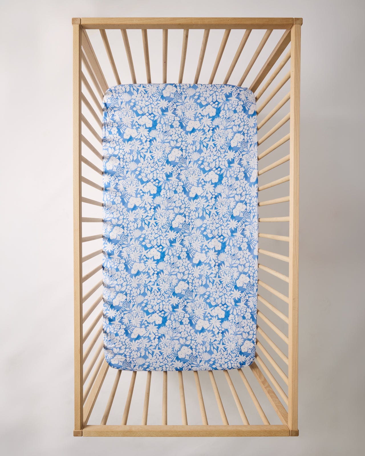 Overhead show of the Azure Garden Fitted Crib Sheet