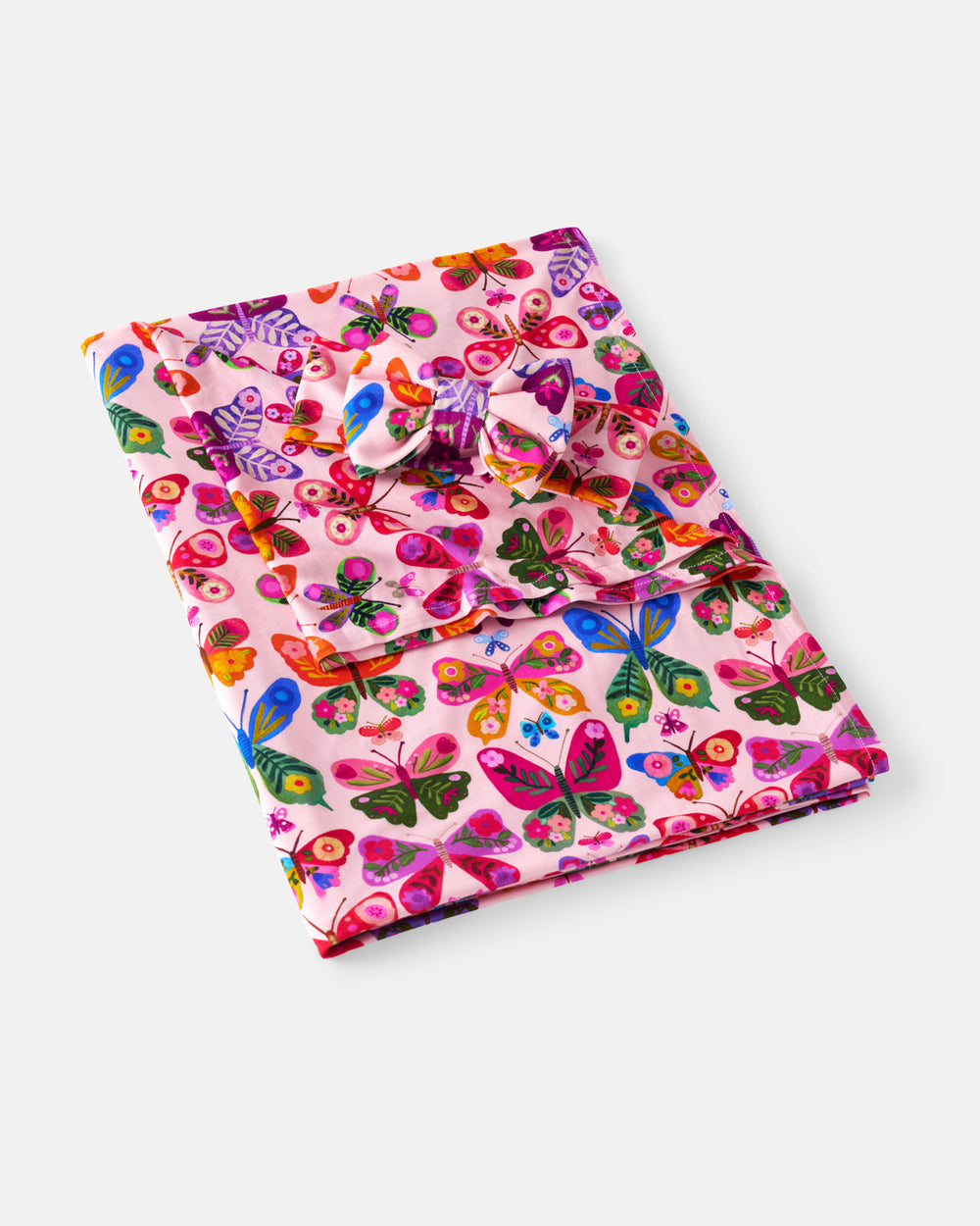 Flat lay of the Flutter Garden Swaddle & Luxe Bow Headband Set