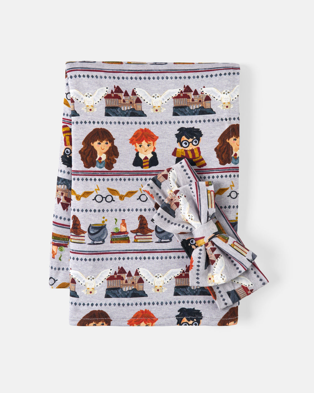 Flat lay of the Harry Potter™ Spellbinding Studies Swaddle & Luxe Bow Headband Set