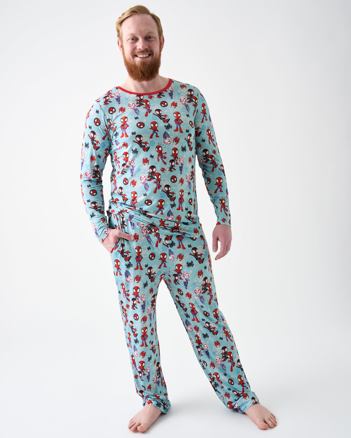 Man wearing the Spidey & Friends Tiny Webs Men's Pajama Pants and Top