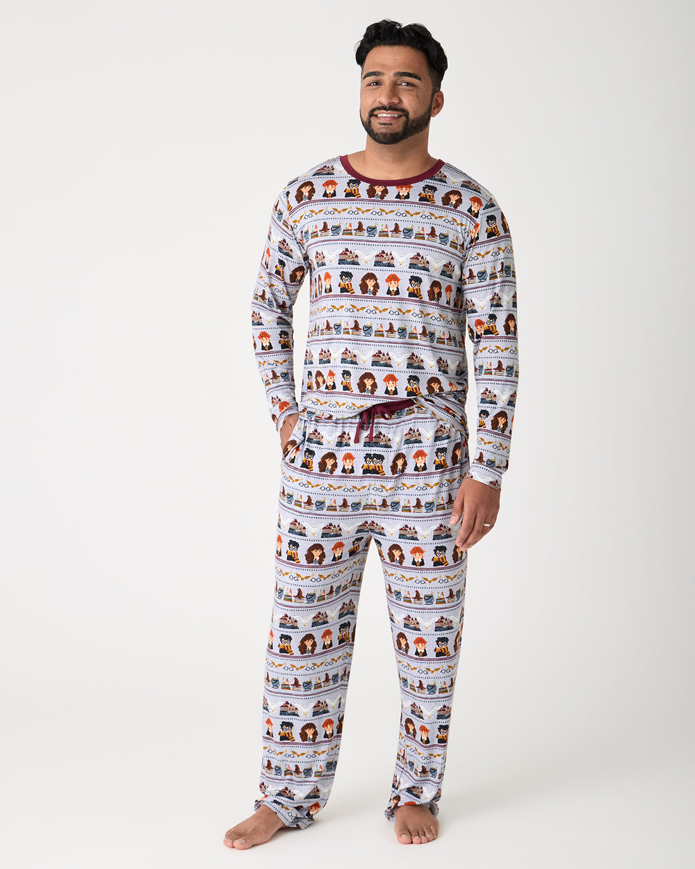 Man wearing the Harry Potter™ Spellbinding Studies Men's Long Sleeve Pajama Top and Pants