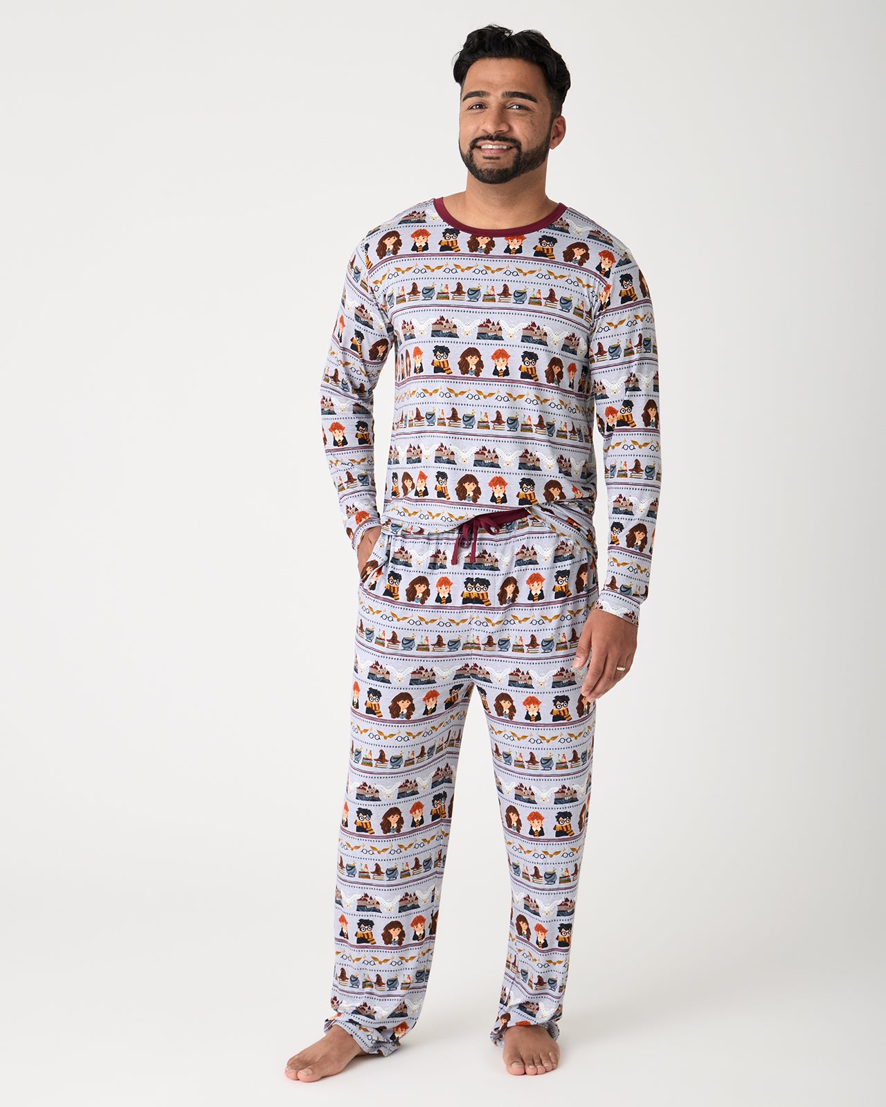 Man wearing the Harry Potter™ Spellbinding Studies Men's Long Sleeve Pajama Top and Pants