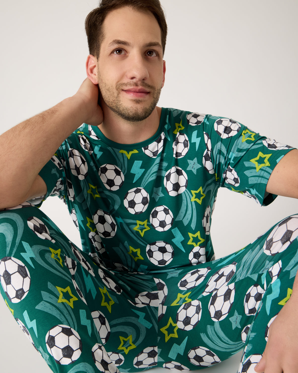 Close up of man wearing the Soccer Stars Men's Short Sleeve Pajama Top and Pants