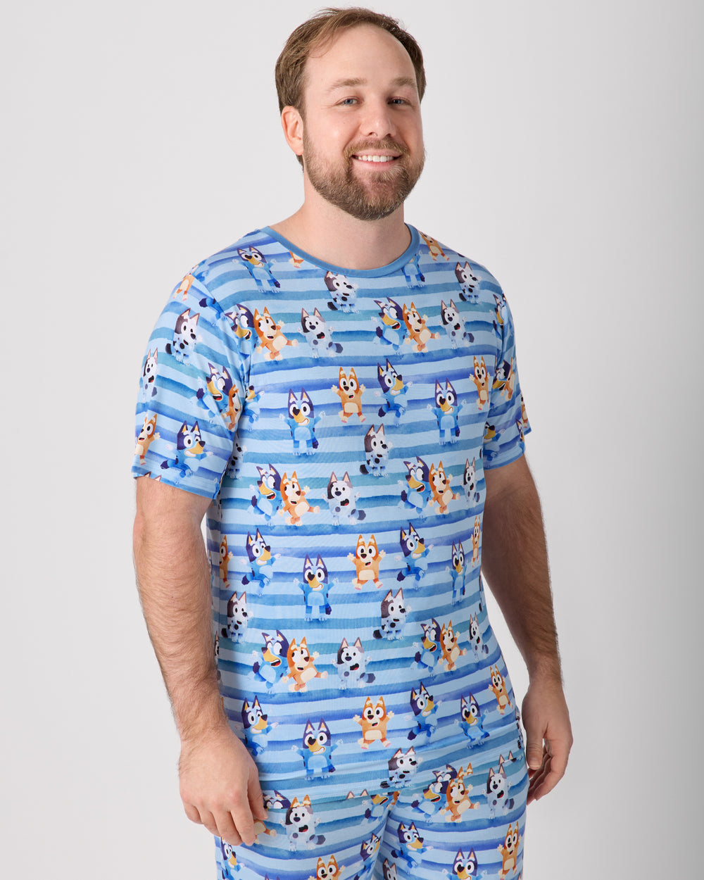 Man wearing the Bluey Dance All Day Men's Short Sleeve Pajama Top