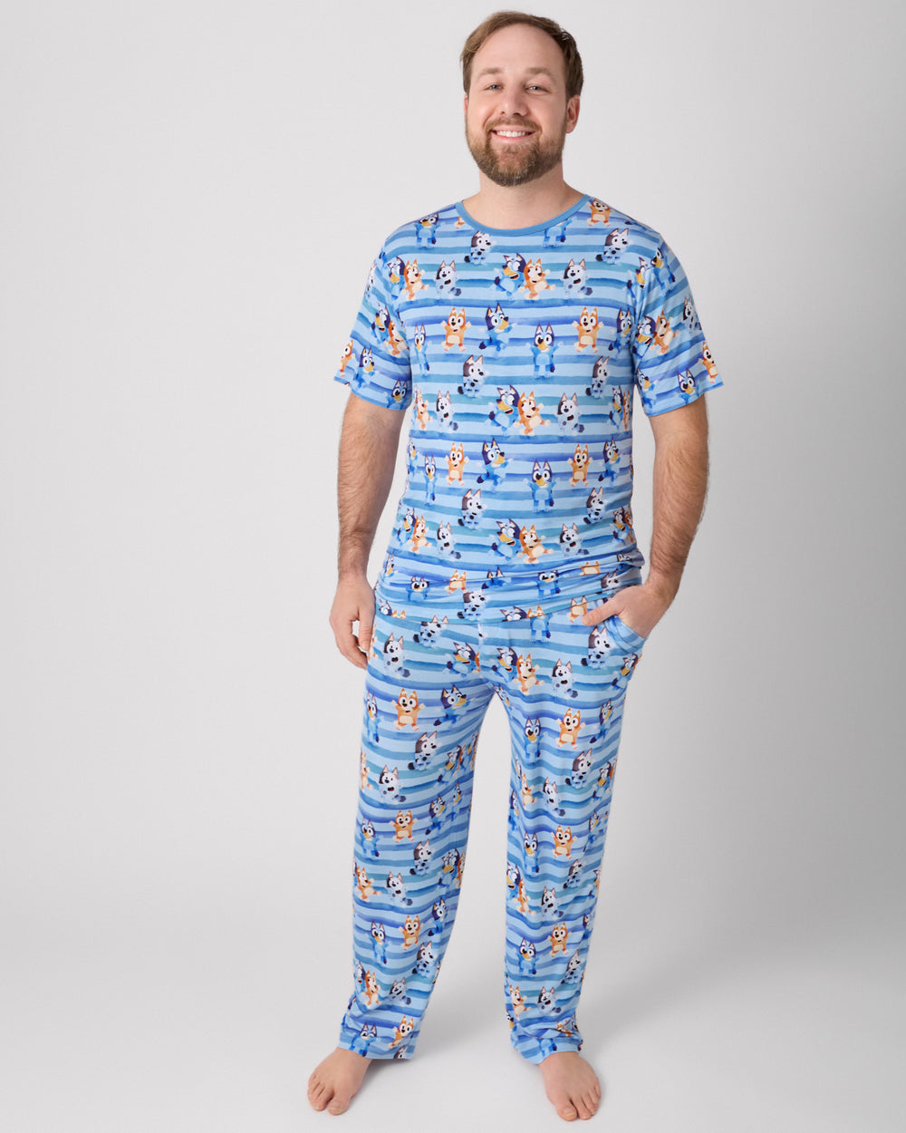 Man wearing the Bluey Dance All Day Men's Short Sleeve Pajama Top and Pants