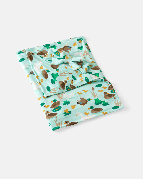Flat lay of the Puddle Jumpers Swaddle & Luxe Bow Headband Set