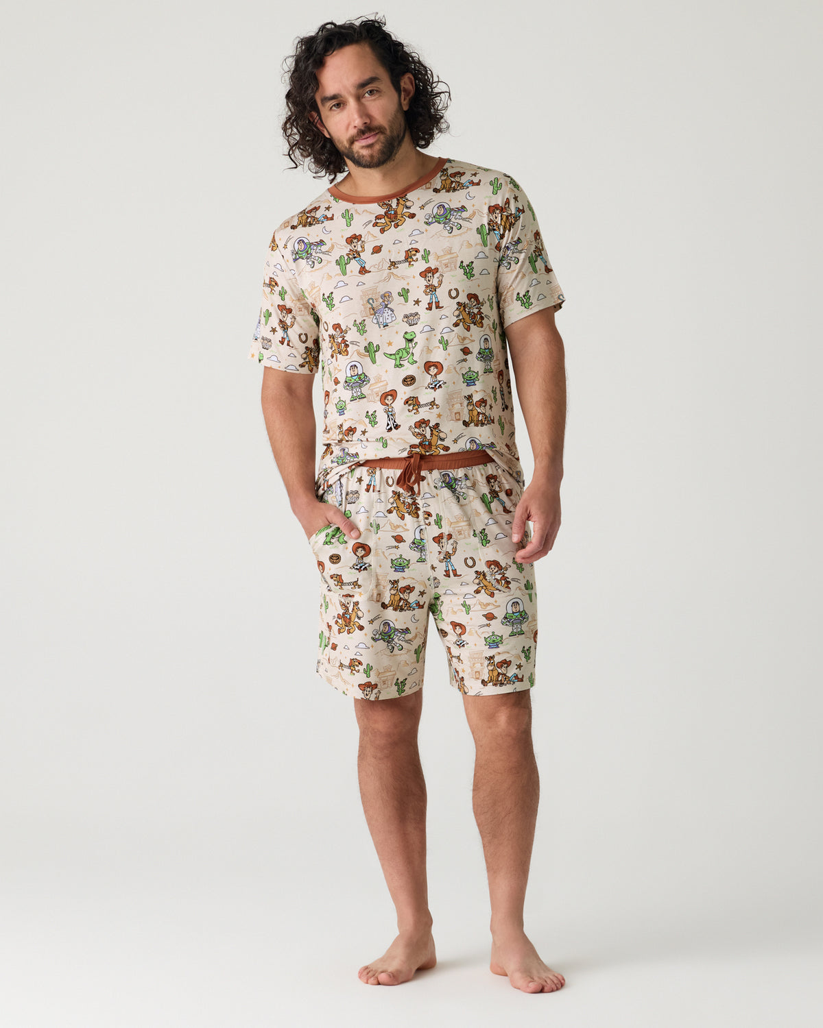 Man wearing the Disney & Pixar Woody's Wild West Men's Pajama Shorts and Top
