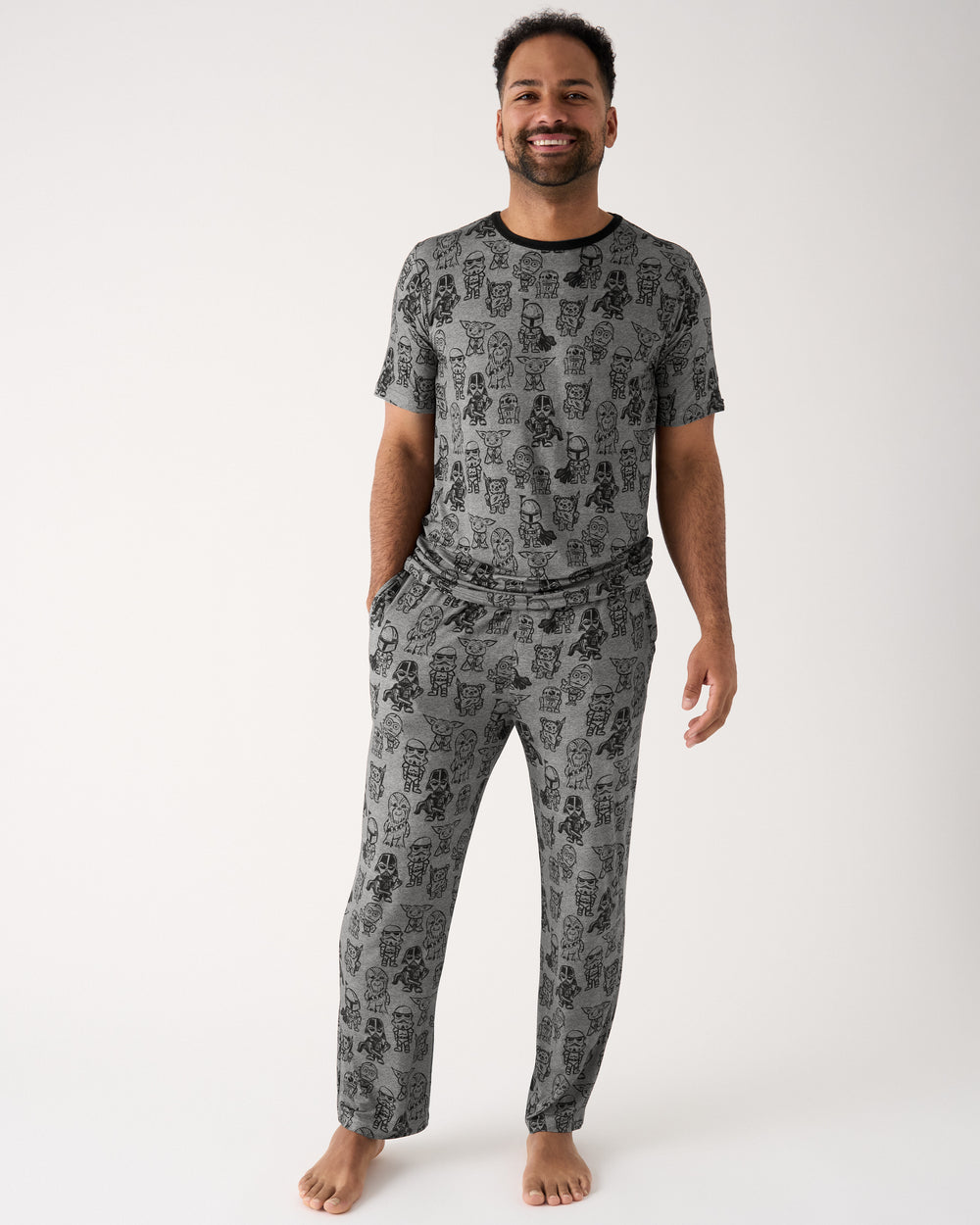 Man wearing the Star Wars Far, Far, Away Friends Men's Short Sleeve Pajama Top and Pants