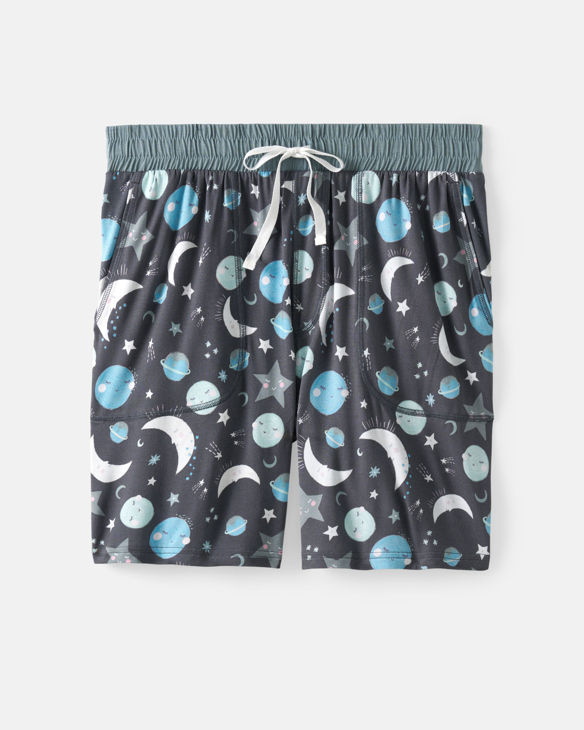 A pair of dark gray drawstring shorts with an all-over space print featuring blue planets, white crescent moons, and white stars, displayed flat against a light gray background.