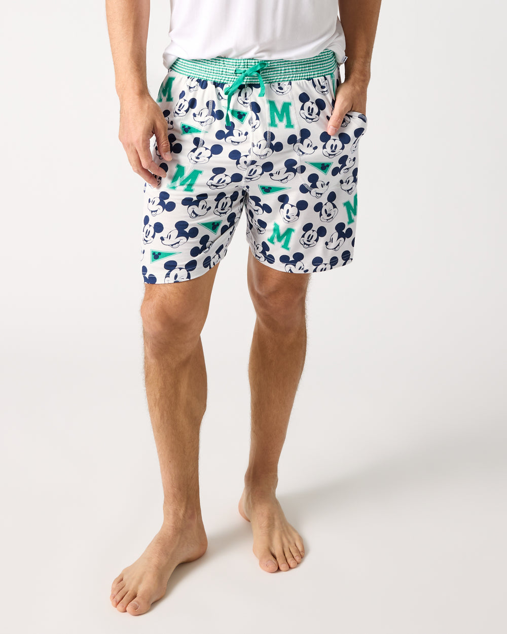 Man wearing the Disney Varsity Mickey Mouse Men's Pajama Shorts