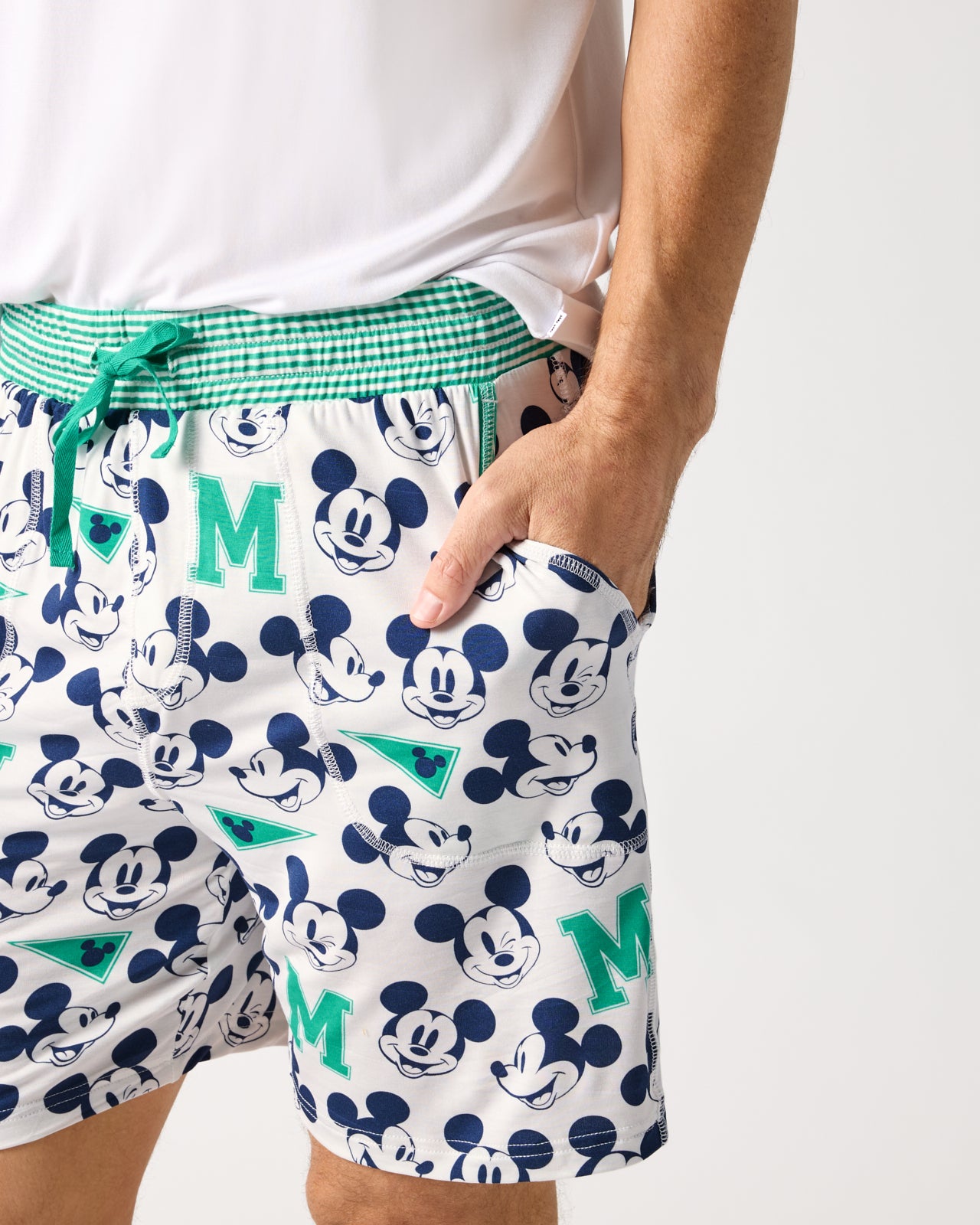 Close up of man wearing the Disney Varsity Mickey Mouse Men's Pajama Shorts