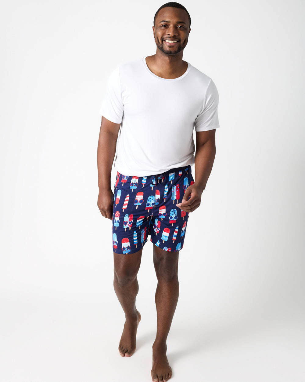 Front view of man wearing the Sparkle Treats Men's Pajama Shorts and white pajama top