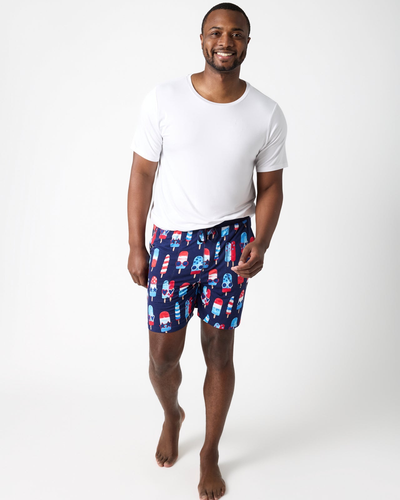 Front view of man wearing the Sparkle Treats Men's Pajama Shorts and white pajama top