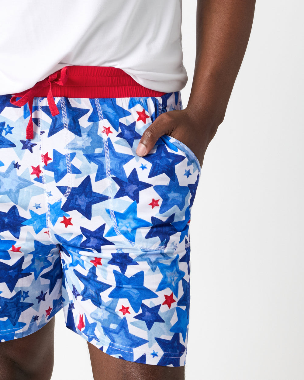 Close up of man wearing the Starry Splash Men's Pajama Shorts