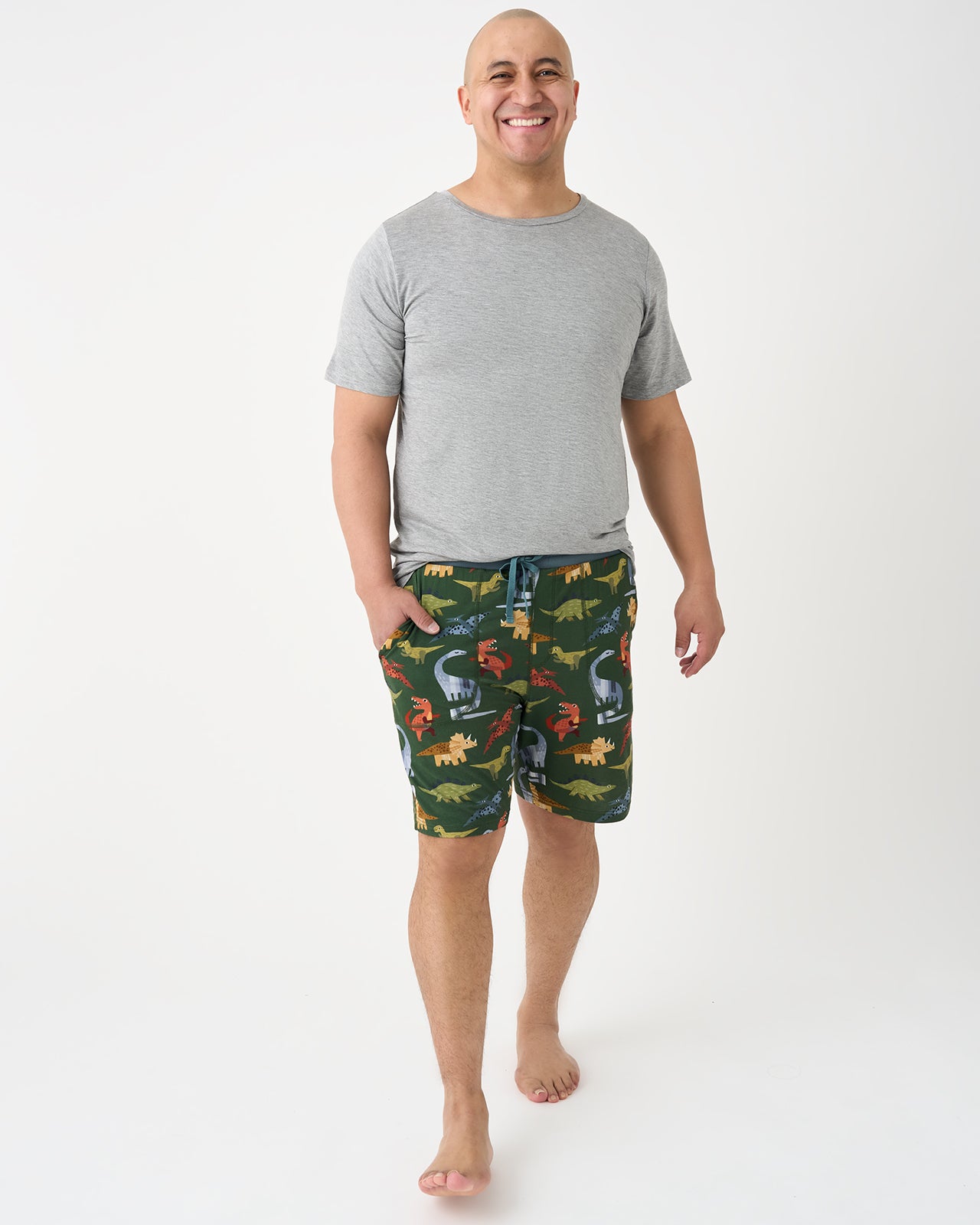 Man wearing the Green Roar & Explore Men's Pajama Shorts with a gray top